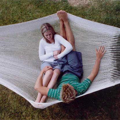Two people in the Mexican Cotton Double Hammock