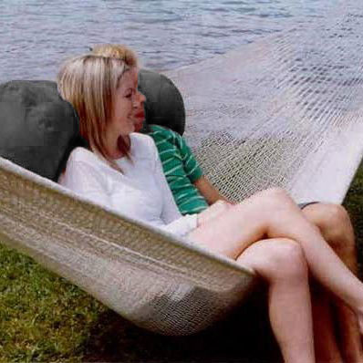 The Outdoor Bolster Cushion in a double hammock